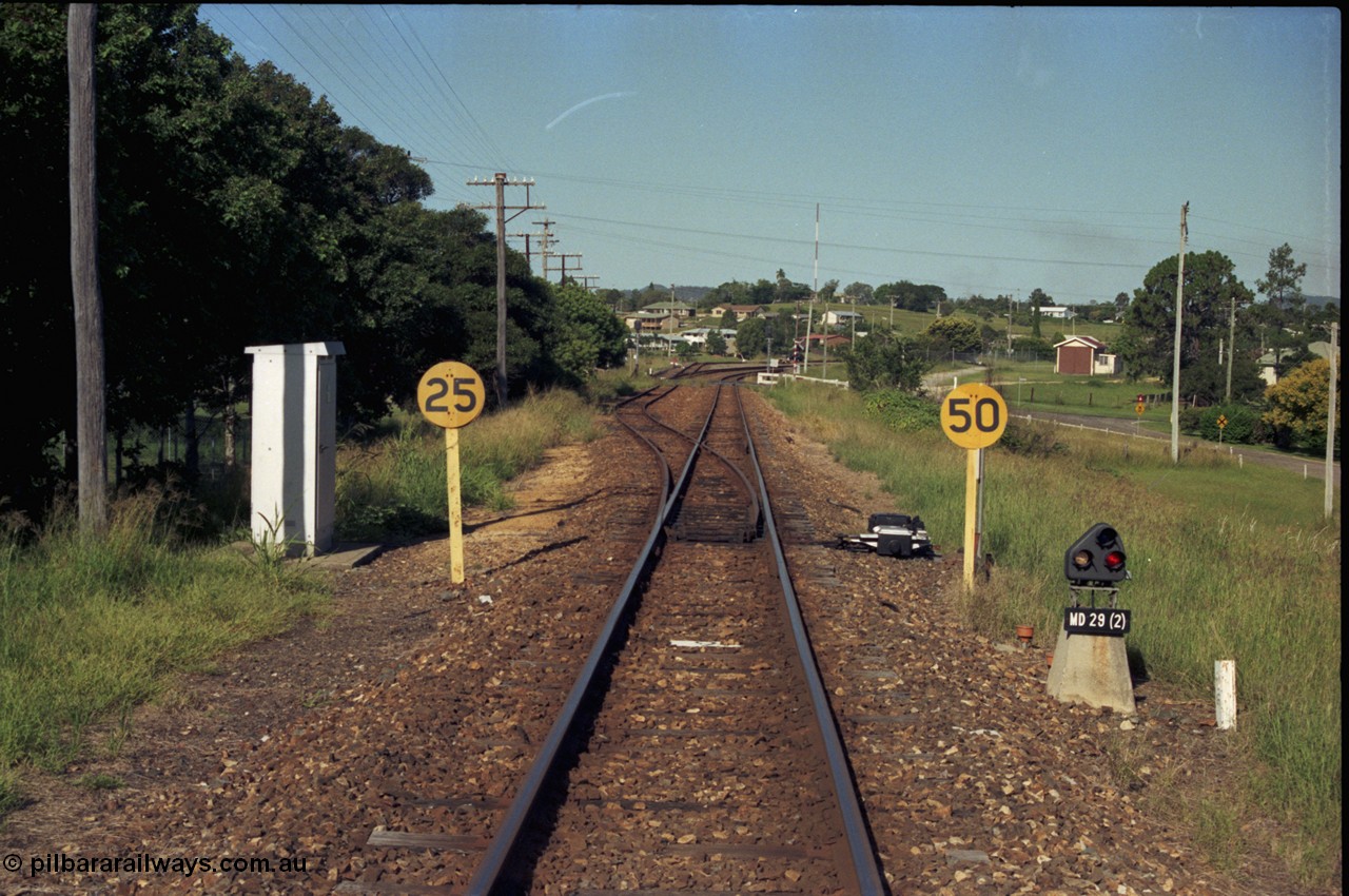 187-04
Monkland, Gympie Queensland. View looking east in the Up direction with the Brisbane Rd grade crossing in the distance. [url=https://goo.gl/maps/bfihzfQbhgN2]GeoData[/url].
