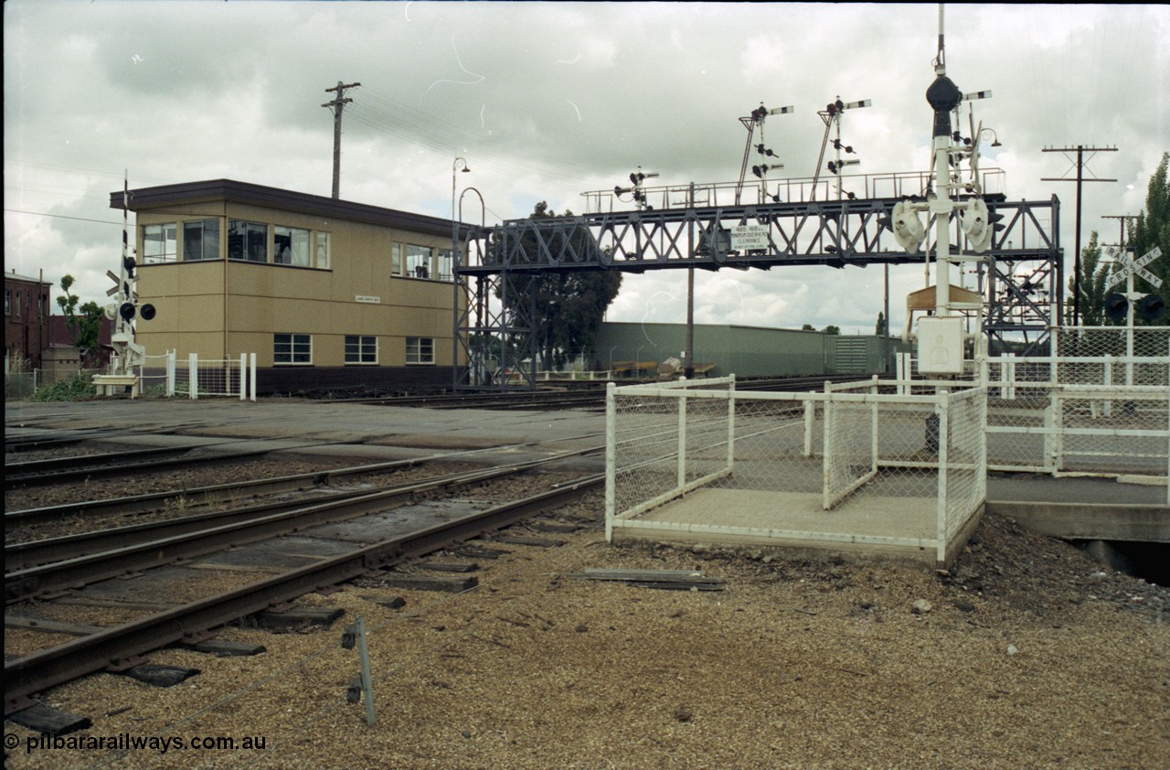 188-26
Junee, NSW Main South, looking north with Junee North Signal Box and the Olympic Hwy grade crossing.
