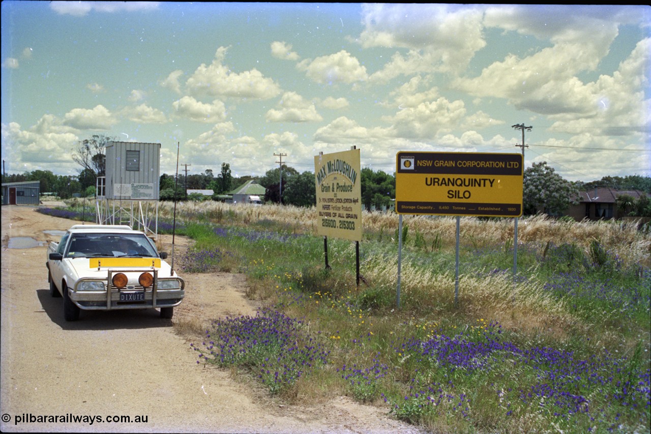 189-03
Uranquinty, sign and building view, the newer weighbridge hut is at the far left, with grain inspection / sampling deck behind the car.
