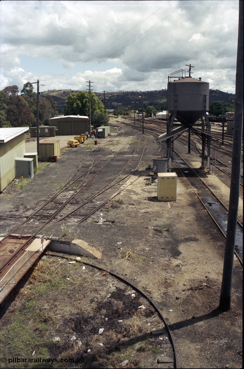190-01
Cootamundra, NSW Main South, looking south from the pedestrian footbridge, past loco depot, turntable visible with sanding tower.
