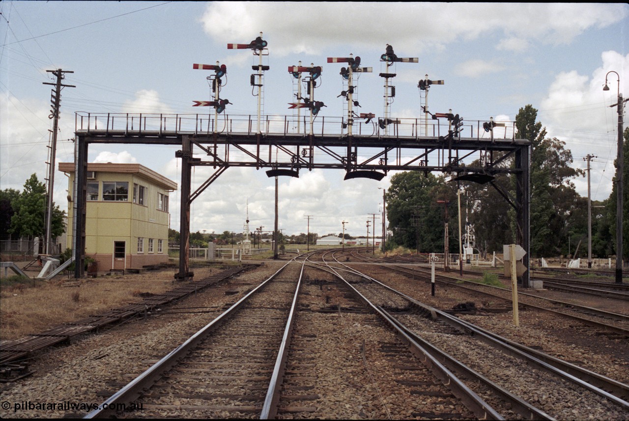 190-09
Cootamundra, NSW Main South, looking north at the 429 km post, North signal box across Pinkerton Rd with the impressive north signal gantry.
