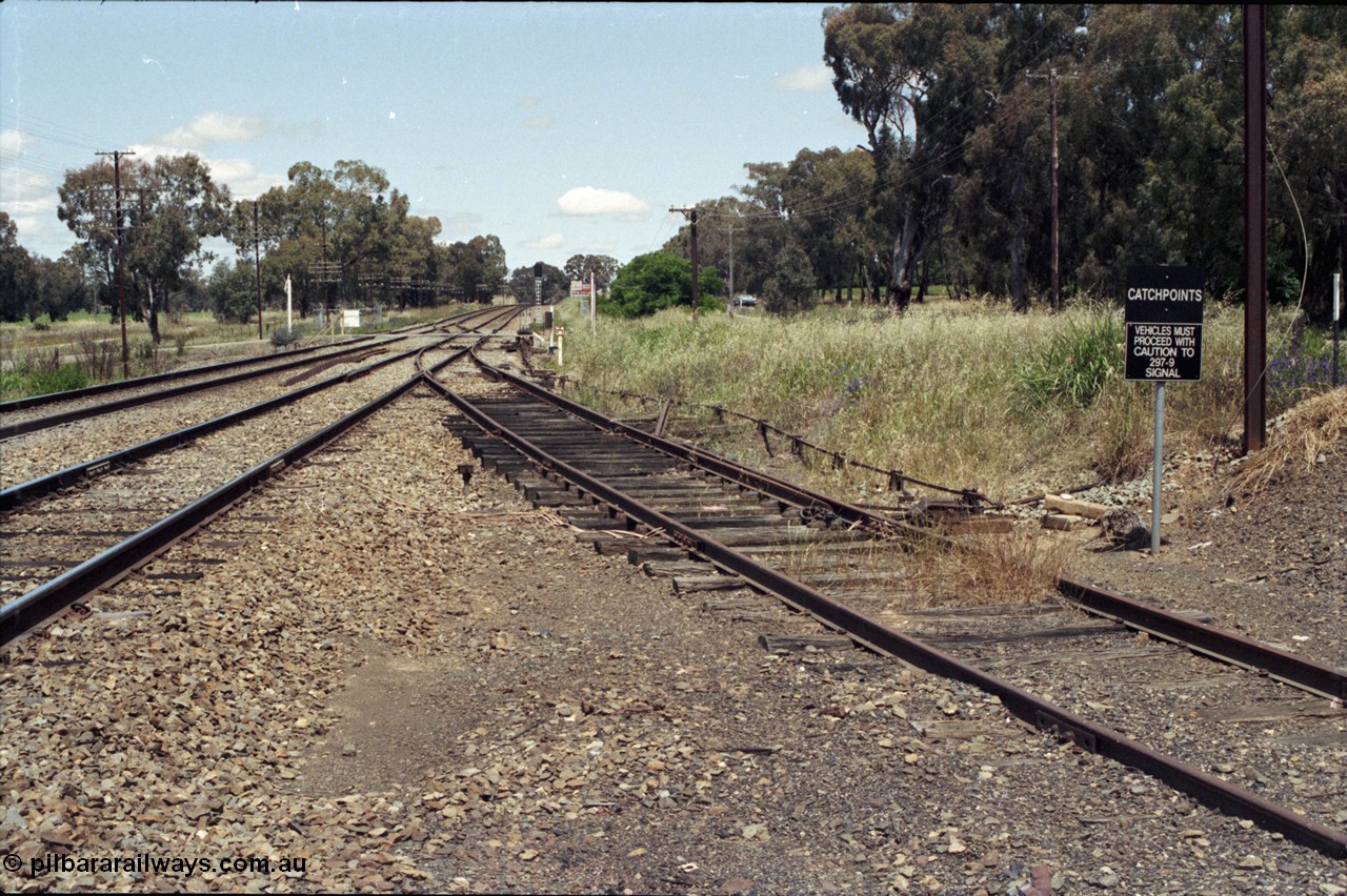 190-31
Marinna, located at the 477.88 km on the NSW Main South line, view looking south with grain siding catch points at right, passive grade crossing and mainline crossover in the distance.
