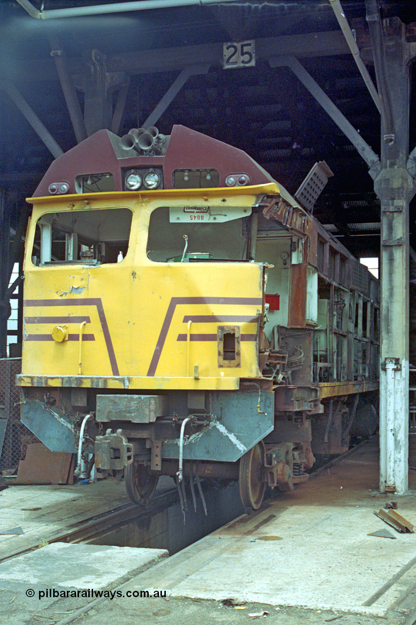 192-08
Junee, NSWSRA standard gauge locomotive depot, accident damaged NSWGR 80 class unit 8045 inside the roundhouse on road 25. An ALCo CE615A model with Mitsubishi electrics built by Comeng NSW in 1982 serial C6121-15.
Keywords: 80-class;8045;Comeng-NSW;ALCo;CE615A;C6121-15;