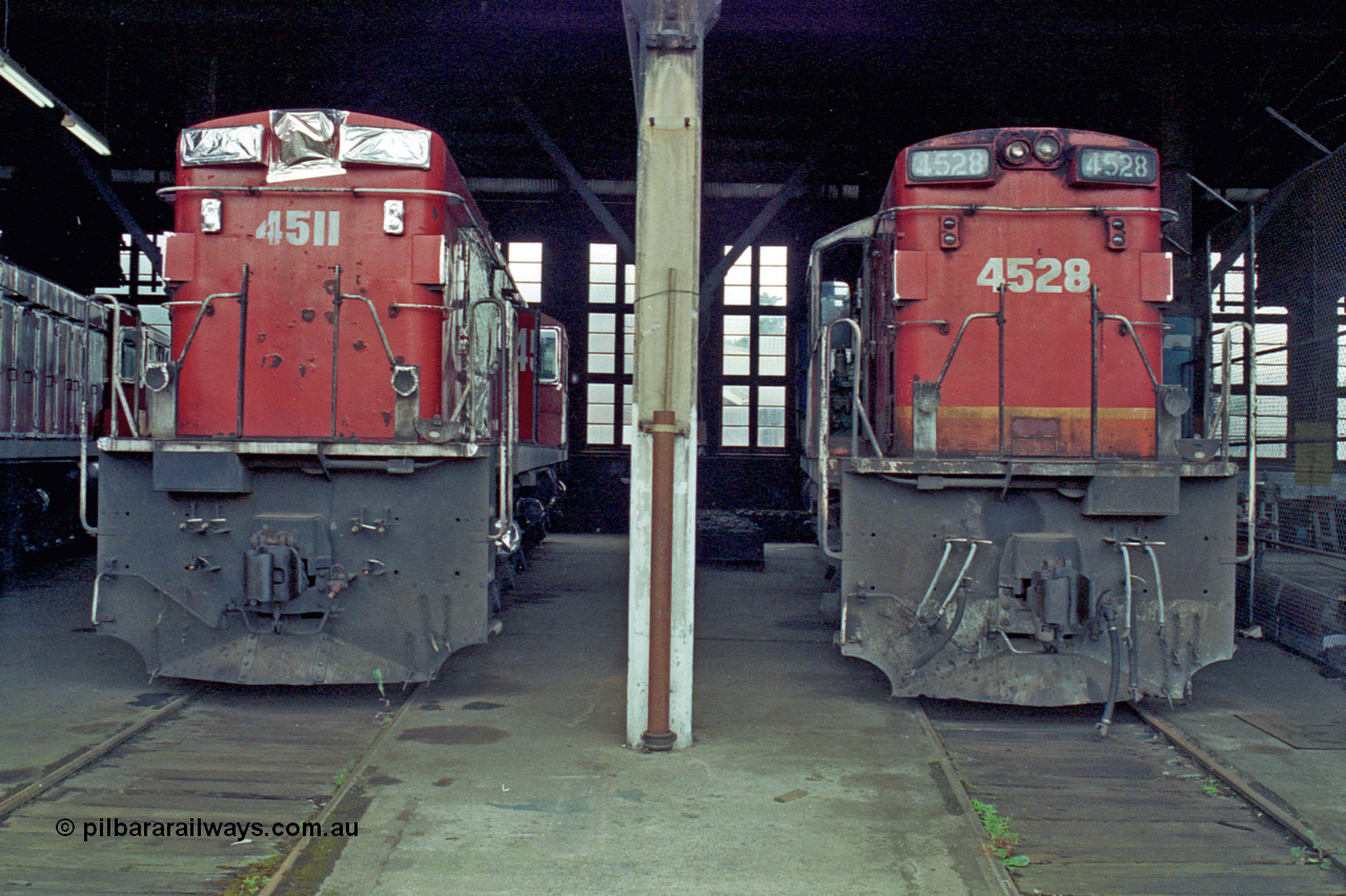 192-11
Junee, NSWSRA standard gauge locomotive depot roundhouse, a pair of ALCo RSD-20 or DL-541 models built by AE Goodwin for NSWGR as the 45 class are in the stages of being sealed up for long term storage, 4511 serial 84153 is already done while 4528 serial 84170 wait its turn.
Keywords: 45-class;4511;AE-Goodwin;ALCo;RSD-20;DL-541;4528;84153;84170;