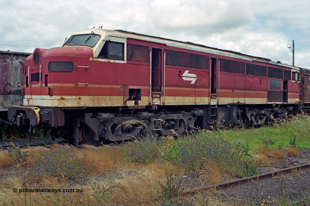 192-15
Junee, NSWSRA standard gauge locomotive depot, a forlorn unidentified 44 class in the NSWSRA candy livery built by AE Goodwin as an ALCo DL500B.
Keywords: 44-class;AE-Goodwin;ALCo;DL-500B;