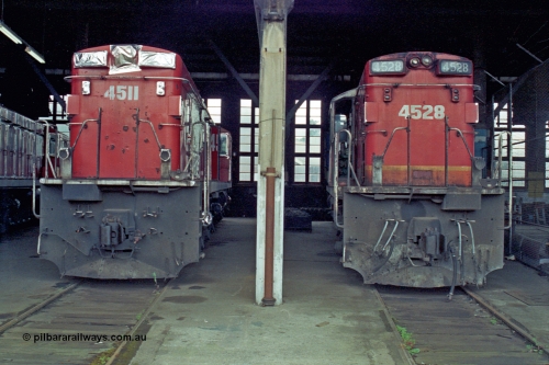 192-11
Junee, NSWSRA standard gauge locomotive depot roundhouse, a pair of ALCo RSD-20 or DL-541 models built by AE Goodwin for NSWGR as the 45 class are in the stages of being sealed up for long term storage, 4511 serial 84153 is already done while 4528 serial 84170 wait its turn.
Keywords: 45-class;4511;AE-Goodwin;ALCo;RSD-20;DL-541;4528;84153;84170;