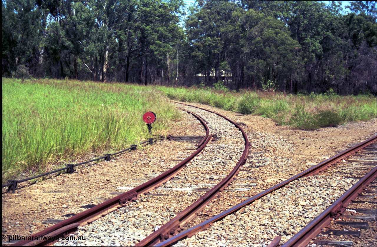 193-12
Moodlu Quarry line curving around to the left with catch point and disc, the line on the right is curving towards Moodlu station site.
