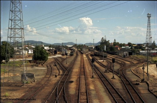 193-16
Gympie station yard overview looking south in the Up direction from the Stewart Terrace overbridge, zoomed in, station and platform in the middle, loco turntable to the right. [url=https://goo.gl/maps/zamovD9hxbu]GeoData[/url].
