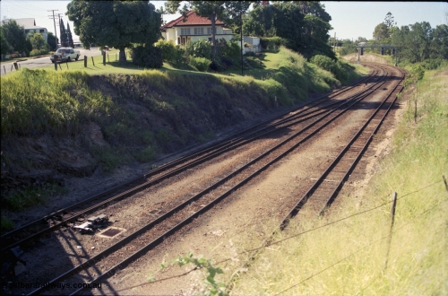 193-17
Gympie station yard entrance looking north towards Gympie North in the Down direction from the Stewart Terrace overbridge. [url=https://goo.gl/maps/zamovD9hxbu]GeoData[/url].
