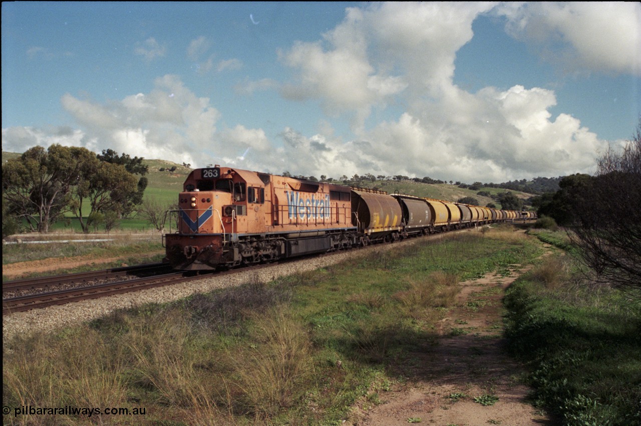 199-03
Toodyay West, empty grain train with standard gauge Westrail L class L 263 Clyde Engineering EMD GT26C serial 68-553 and forty empty waggons at Northam-Toodyay Rd Katrine. 1316 hrs on 21st June 1997.
Keywords: L-class;L263;Clyde-Engineering-Granville-NSW;EMD;GT26C;68-553;