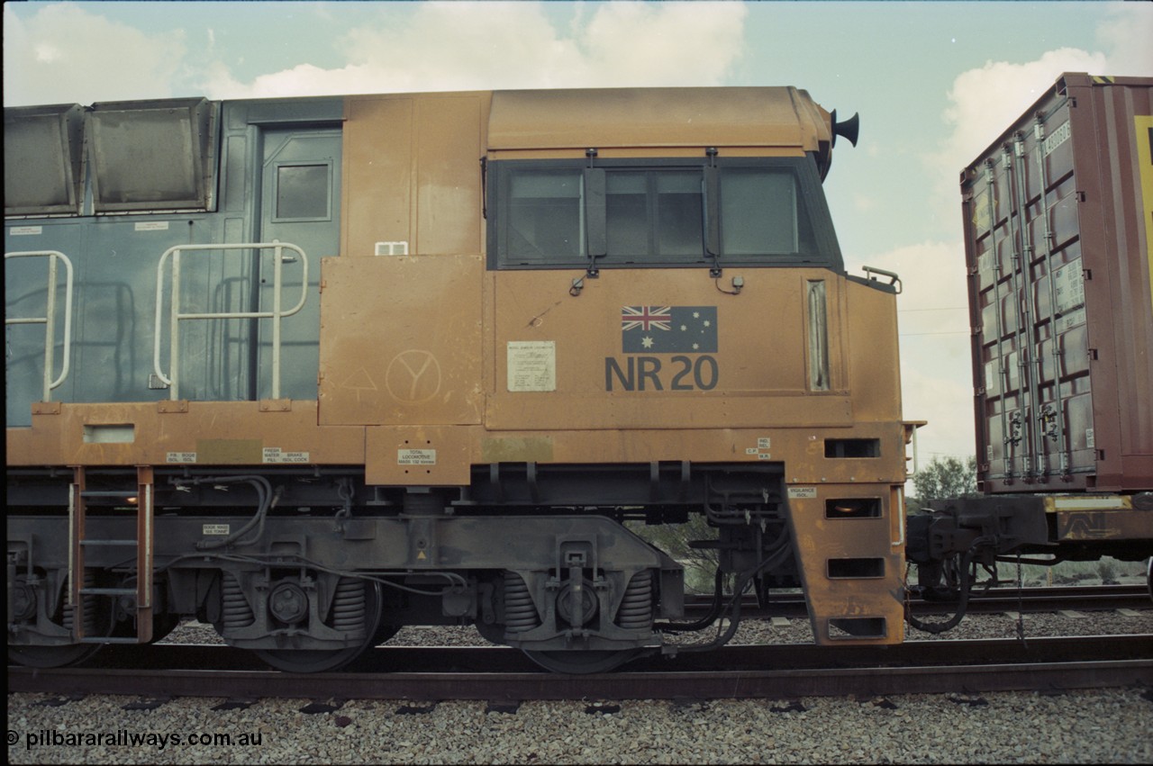 199-09
Meckering, National Rail NR class unit NR 20 Goninan built GE Cv40-9i model, cab side view on train 7PM5 as it waits for a cross with the Prospector in the loop 1400 hrs 21st June 1997.
Keywords: NR-class;NR20;Goninan;GE;CV40-9i;7250-04/97-222;