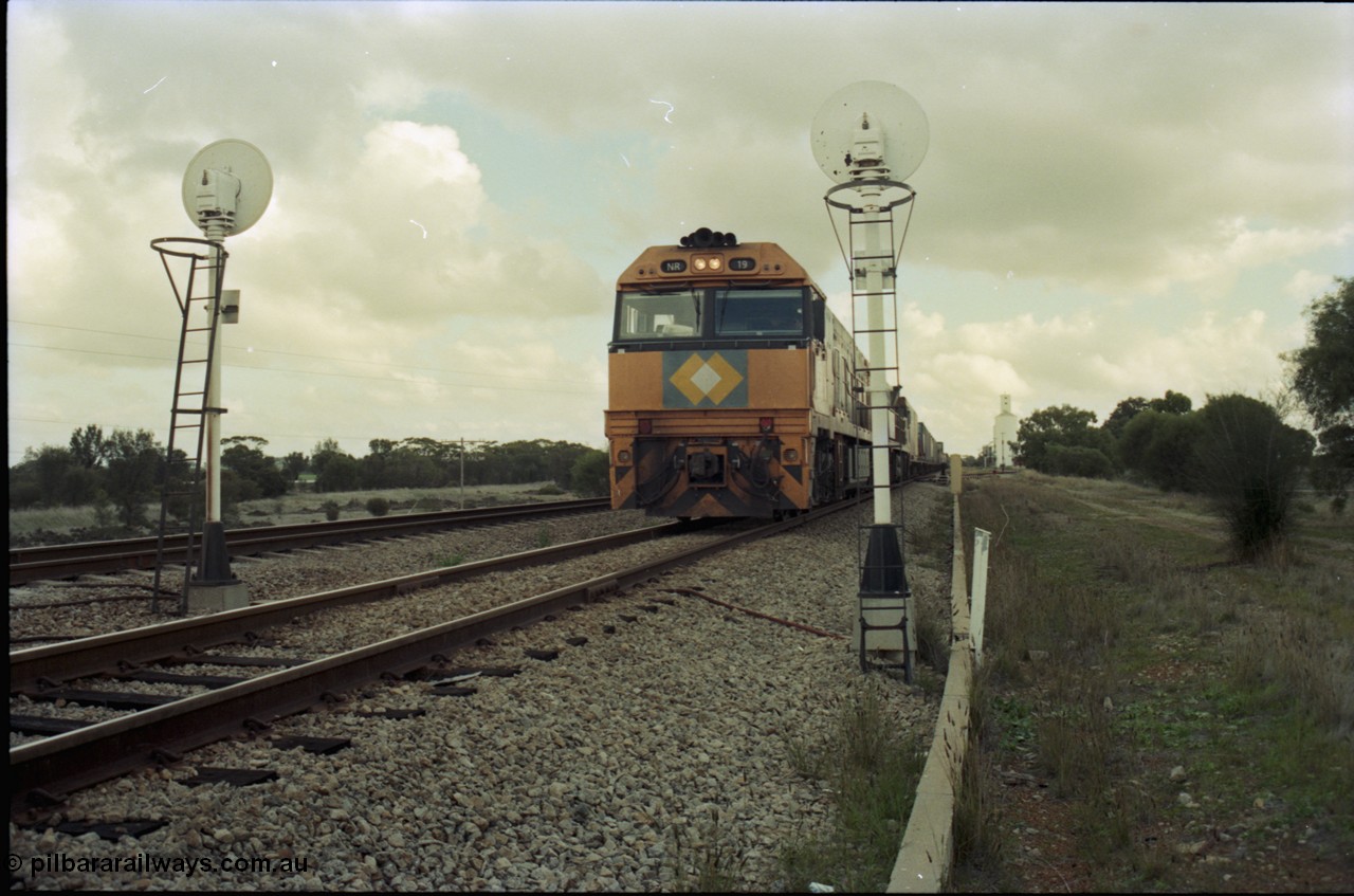 199-11
Meckering, National Rail NR class units NR 19 and NR 20 both being Goninan built GE Cv40-9i models head up train 7PM5 as they wait for a cross with the Prospector in the loop 1400 hrs 21st June 1997.
Keywords: NR-class;NR19;Goninan;GE;CV40-9i;7250-03/97-221;