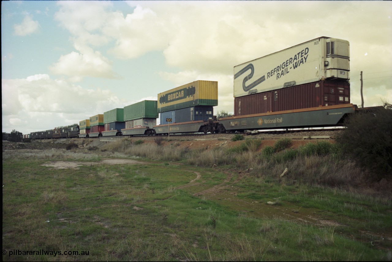 199-22
Meckering, train 7PM5 double stacked east bound with BOX CAR and Refrigerated Rail-Way containers and reefers, 21st June 1997.
