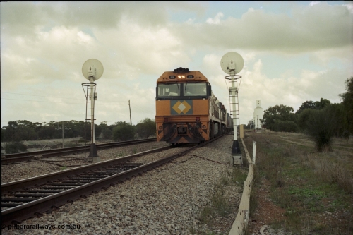 199-05
Meckering, National Rail NR class units NR 19 and NR 20 both being Goninan built GE Cv40-9i models head up train 7PM5 as they wait for a cross with the Prospector in the loop 1400 hrs 21st June 1997.
Keywords: NR-class;NR19;Goninan;GE;CV40-9i;7250-03/97-221;