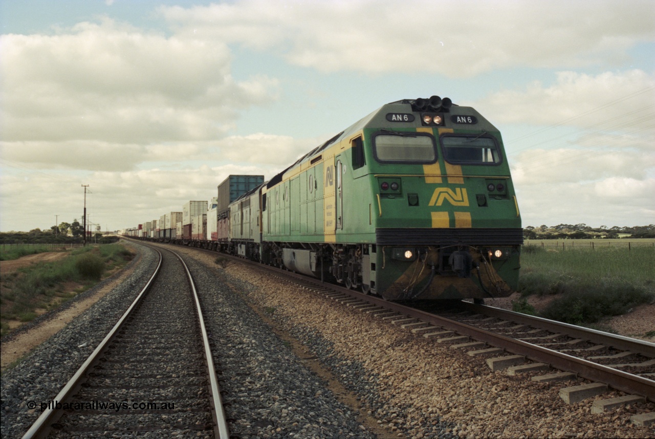 200-09
Moorine Rock, Australian National AN class AN 6 a Clyde Engineering built EMD model JT46C serial 93-1302, sits on the mainline with a Perth bound freight, 1500 hrs 22nd June 1997.
Keywords: AN-class;AN6;Clyde-Engineering-Somerton-Victoria;EMD;JT46C;93-1302;