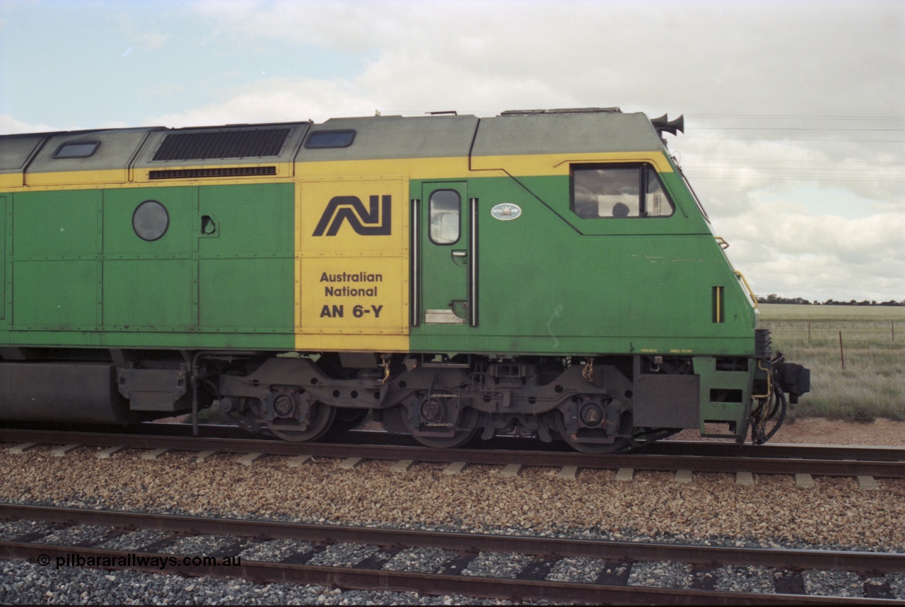 200-11
Moorine Rock, Australian National AN class AN 6 a Clyde Engineering built EMD model JT46C serial 93-1302, cab side view sits on the mainline with a Perth bound freight, 1500 hrs 22nd June 1997.
Keywords: AN-class;AN6;Clyde-Engineering-Somerton-Victoria;EMD;JT46C;93-1302;