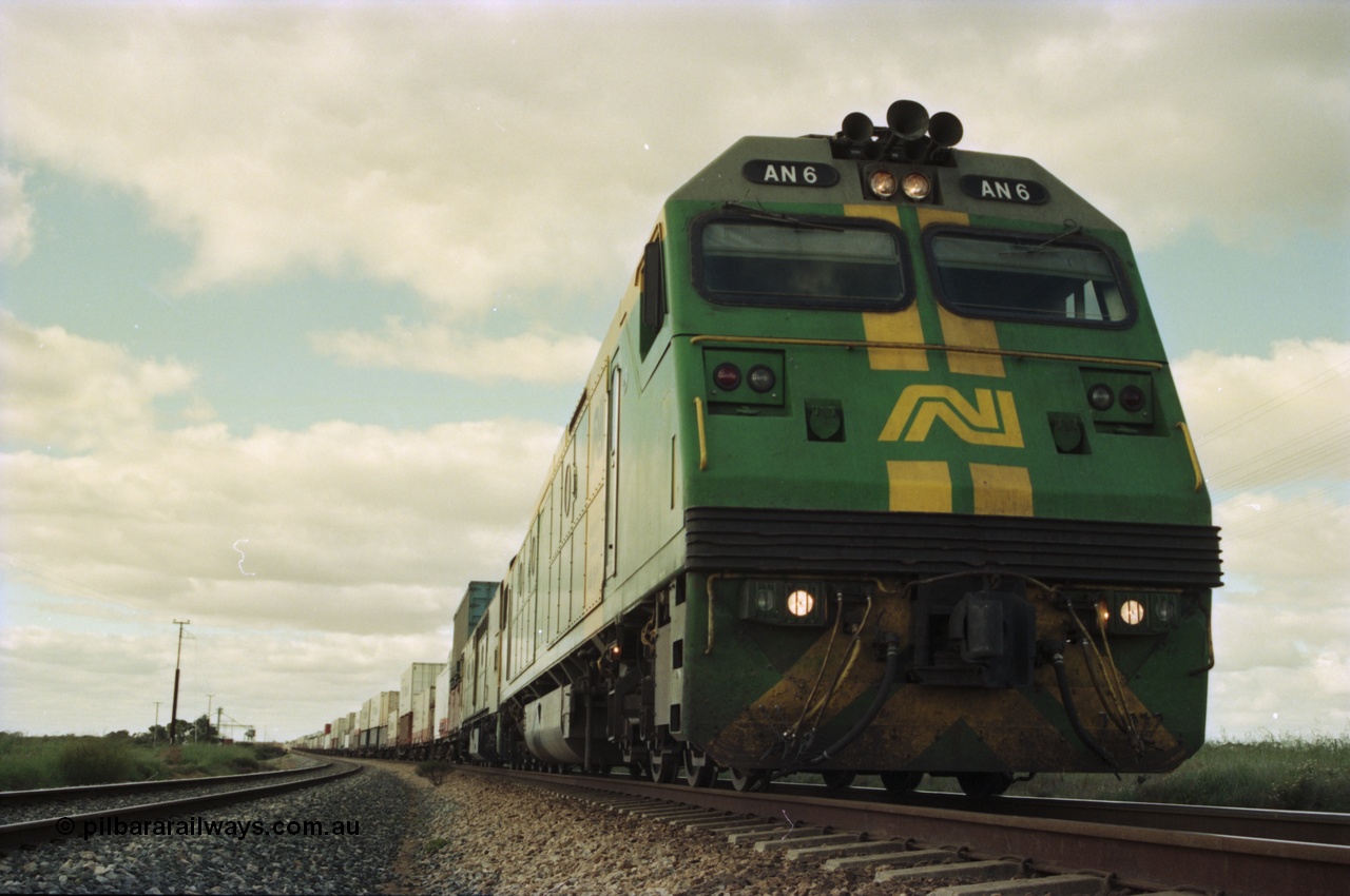 200-16
Moorine Rock, Australian National AN class AN 6 a Clyde Engineering built EMD model JT46C serial 93-1302, sits on the mainline with a Perth bound freight, 22nd June 1997.
Keywords: AN-class;AN6;Clyde-Engineering-Somerton-Victoria;EMD;JT46C;93-1302;