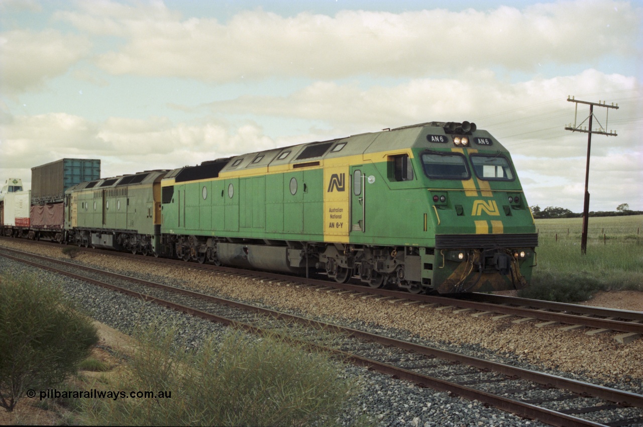 200-17
Moorine Rock, Australian National AN class AN 6 a Clyde Engineering built EMD model JT46C serial 93-1302 and ALF class 24 on the mainline with a Perth bound freight, 22nd June 1997.
Keywords: AN-class;AN6;Clyde-Engineering-Somerton-Victoria;EMD;JT46C;93-1302;