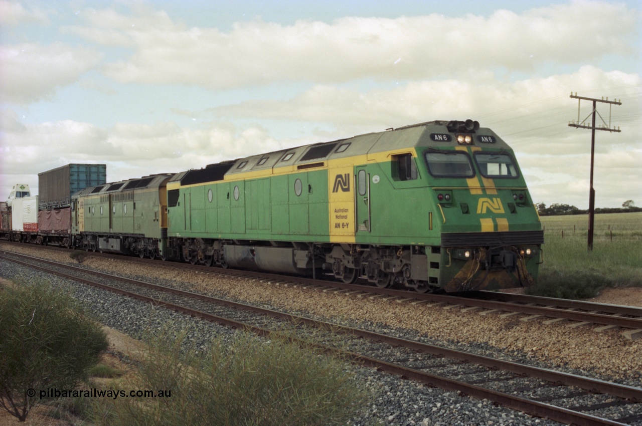 200-18
Moorine Rock, Australian National AN class AN 6 a Clyde Engineering built EMD model JT46C serial 93-1302 and ALF class ALF 24 on the mainline with a Perth bound freight, 22nd June 1997.
Keywords: AN-class;AN6;Clyde-Engineering-Somerton-Victoria;EMD;JT46C;93-1302;