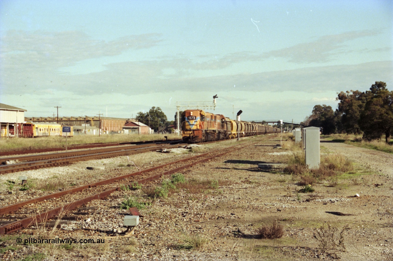 200-19
Midland, Westrail's Clyde Engineering built EMD model G26C as the DA class, DA 1573 serial 72-760 and DA 1574 serial 72-761 lead an empty grain train to Avon past the Midland Workshops at 0925 hrs 24th June 1997.
Keywords: DA-class;DA1573;Clyde-Engineering-Granville-NSW;EMD;G26C;72-760;