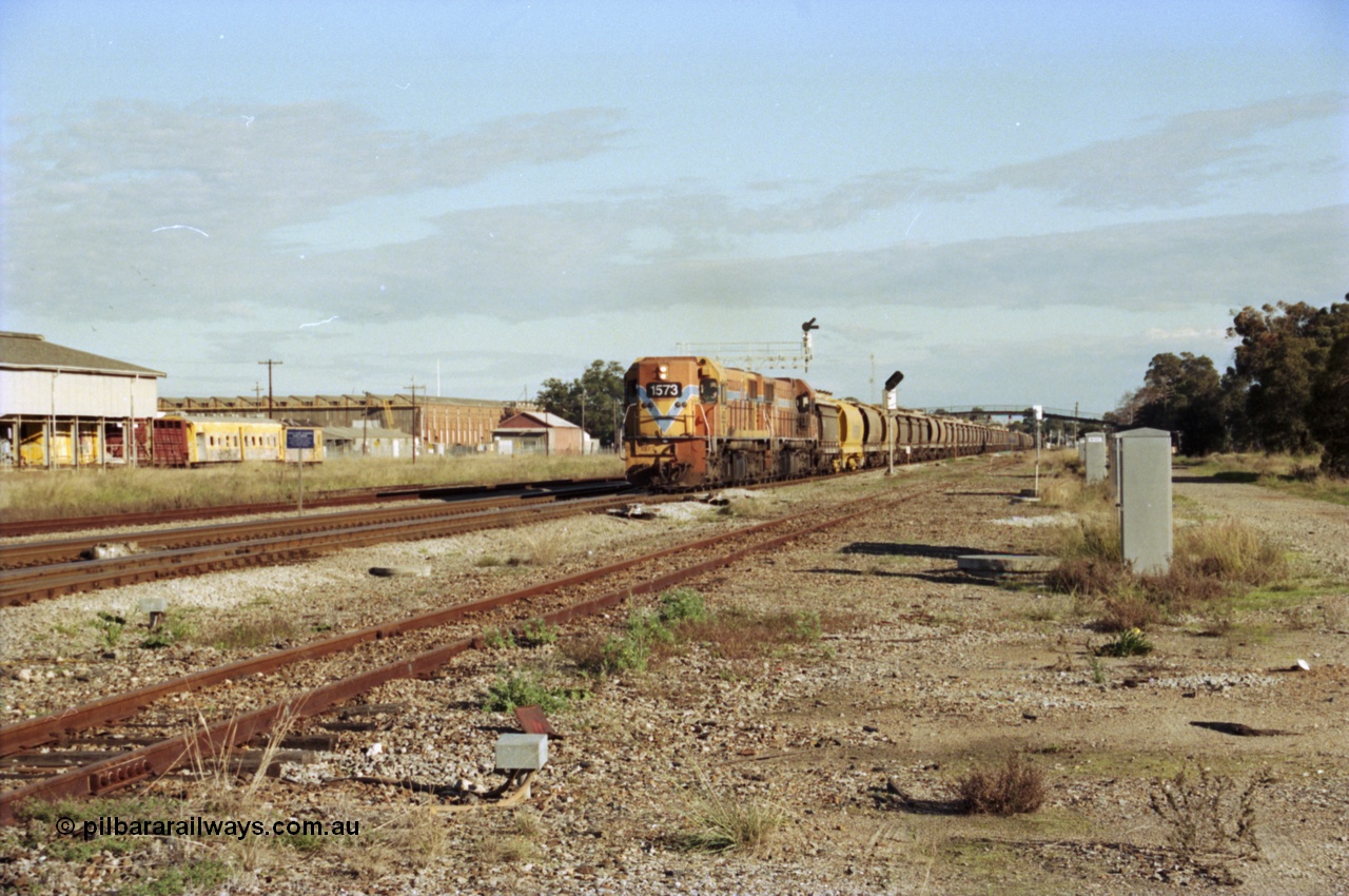 200-20
Midland, Westrail's Clyde Engineering built EMD model G26C as the DA class, DA 1573 serial 72-760 and DA 1574 serial 72-761 lead an empty grain train to Avon past the Midland Workshops at 0925 hrs 24th June 1997.
Keywords: DA-class;DA1573;Clyde-Engineering-Granville-NSW;EMD;G26C;72-760;