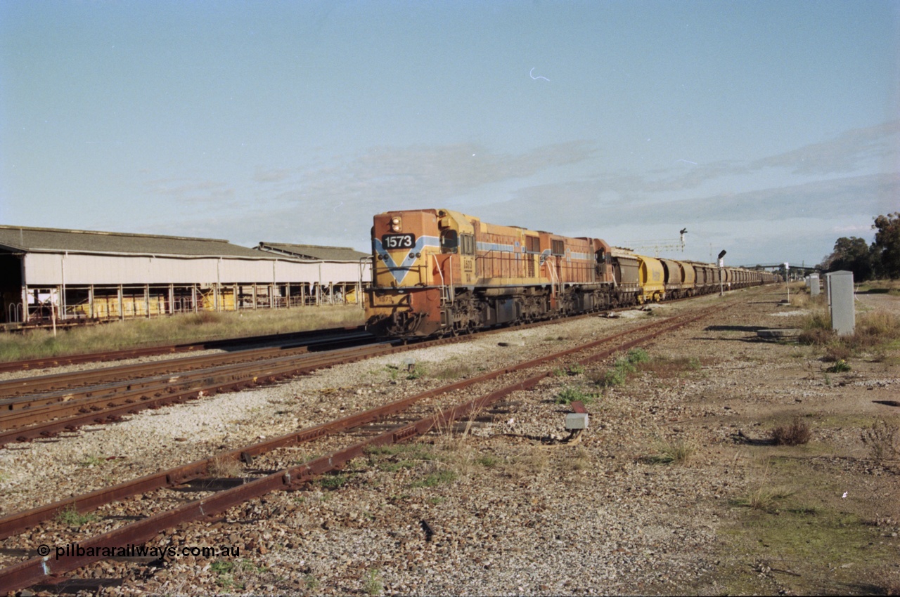 200-21
Midland, Westrail's Clyde Engineering built EMD model G26C as the DA class, DA 1573 serial 72-760 and DA 1574 serial 72-761 lead an empty grain train to Avon past the Midland Workshops at 0925 hrs 24th June 1997.
Keywords: DA-class;DA1573;Clyde-Engineering-Granville-NSW;EMD;G26C;72-760;