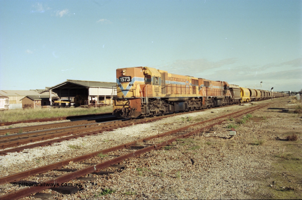 200-22
Midland, Westrail's Clyde Engineering built EMD model G26C as the DA class, DA 1573 serial 72-760 and DA 1574 serial 72-761 lead an empty grain train to Avon past the Midland Workshops at 0925 hrs 24th June 1997.
Keywords: DA-class;DA1573;Clyde-Engineering-Granville-NSW;EMD;G26C;72-760;