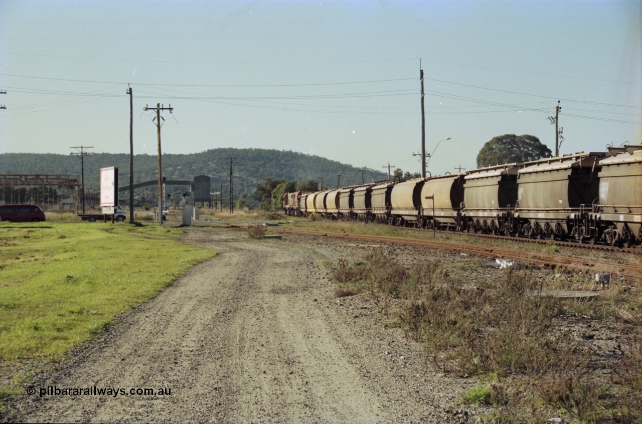 200-25
Midland, Westrail's Clyde Engineering built EMD model G26C as the DA class, DA 1573 serial 72-760 and DA 1574 serial 72-761 lead an empty grain train to Avon across the Lloyd Street grade crossing, 0925 hrs 24th June 1997.
Keywords: DA-class;DA1573;Clyde-Engineering-Granville-NSW;EMD;G26C;72-760;