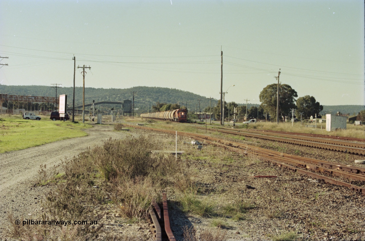 200-30
Midland, loaded standard gauge grain train behind Westrail L class L 264 Clyde Engineering built EMD model GT26C serial 68-554 about to cross Lloyd Street grade crossing 0940 hrs 24th June 1997.
Keywords: L-class;L264;Clyde-Engineering-Granville-NSW;EMD;GT26C;68-554;