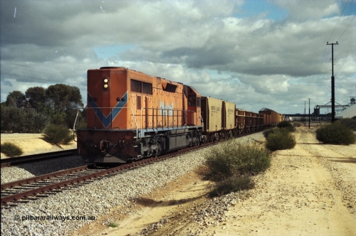 200-03
Moorine Rock, Westrail L class 271 Clyde Engineering EMD model GT26C serial 69-620 runs through the loop with the ballast cleaning train, known as the Circus Train while a Perth bound freighter sits in the mainline, 22nd June 1997.
Keywords: L-class;L271;Clyde-Engineering-Granville-NSW;EMD;GT26C;69-620;