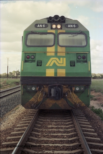200-08
Moorine Rock, Australian National AN class unit AN 6 Clyde Engineering EMD model JT46C serial 93-1302, front view sits on the mainline with a Perth bound freight at 1500 hrs 22nd June 1997.
Keywords: AN-class;AN6;Clyde-Engineering-Somerton-Victoria;EMD;JT46C;93-1302;