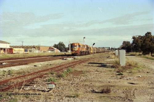 200-19
Midland, Westrail's Clyde Engineering built EMD model G26C as the DA class, DA 1573 serial 72-760 and DA 1574 serial 72-761 lead an empty grain train to Avon past the Midland Workshops at 0925 hrs 24th June 1997.
Keywords: DA-class;DA1573;Clyde-Engineering-Granville-NSW;EMD;G26C;72-760;