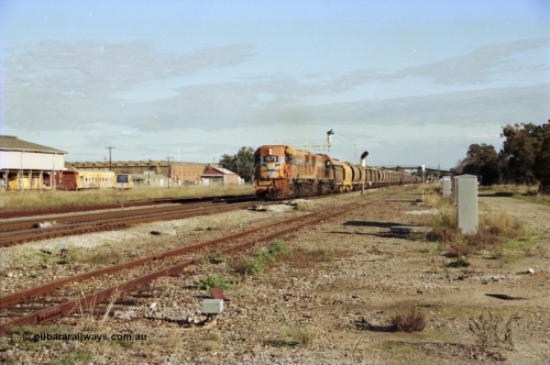 200-20
Midland, Westrail's Clyde Engineering built EMD model G26C as the DA class, DA 1573 serial 72-760 and DA 1574 serial 72-761 lead an empty grain train to Avon past the Midland Workshops at 0925 hrs June 24, 1997.
Keywords: DA-class;DA1573;Clyde-Engineering-Granville-NSW;EMD;G26C;72-760;