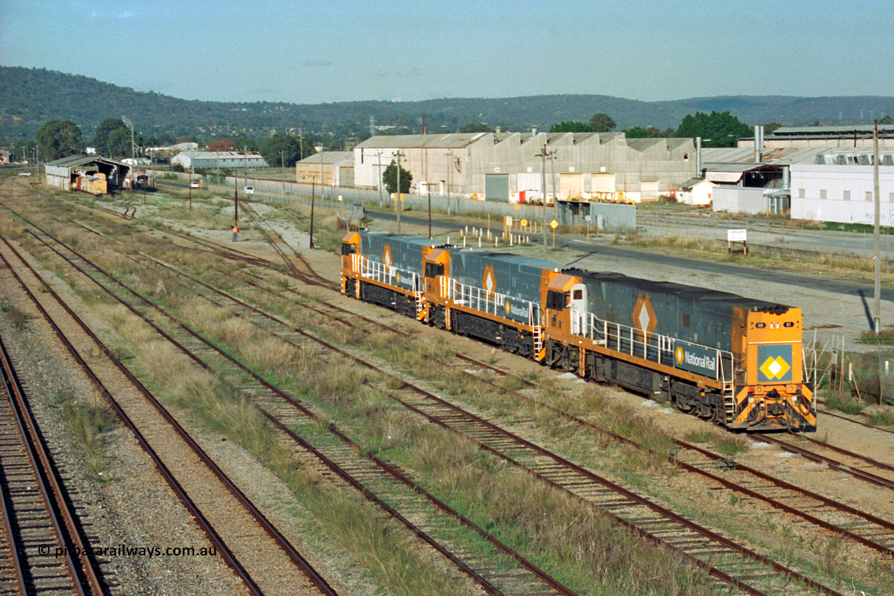 201-06
Midland, the first Perth built NR class NR 61 Goninan GE model Cv40-9i serial 7250-11/96-263 shunts at Midland with two brand new NR units.
Keywords: NR-class;NR61;Goninan;GE;CV40-9i;7250-11/96-263;