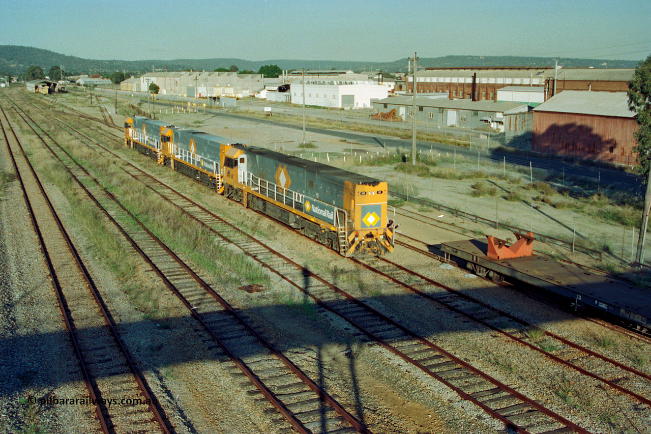 201-14
Midland, the first Perth built NR class NR 61 Goninan GE model Cv40-9i serial 7250-11/96-263 shunts at Midland with two brand new NR units and waggon RQRX type RQRX 60177.
Keywords: NR-class;NR61;Goninan;GE;CV40-9i;7250-11/96-263;