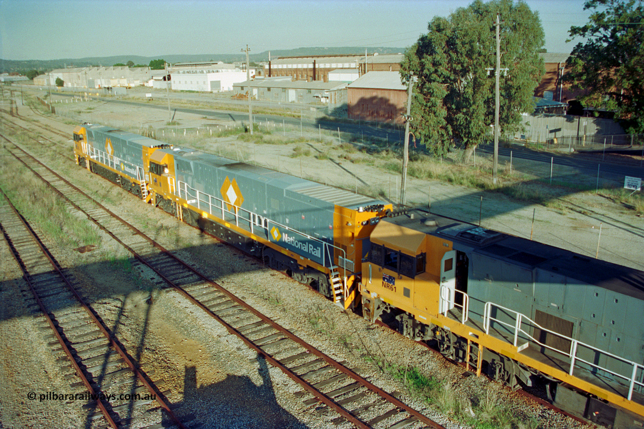 201-15
Midland, two brand Goninan WA built GE Cv40-9i model NR class units NR 101 serial 7250-07/97-303 and NR 102 serial 7250-07/97-302 with the original Perth built NR 61 serial 7250-11/96-263 as the shunt around the yard.
Keywords: NR-class;NR101;Goninan;GE;CV40-9i;7250-07/97-303;