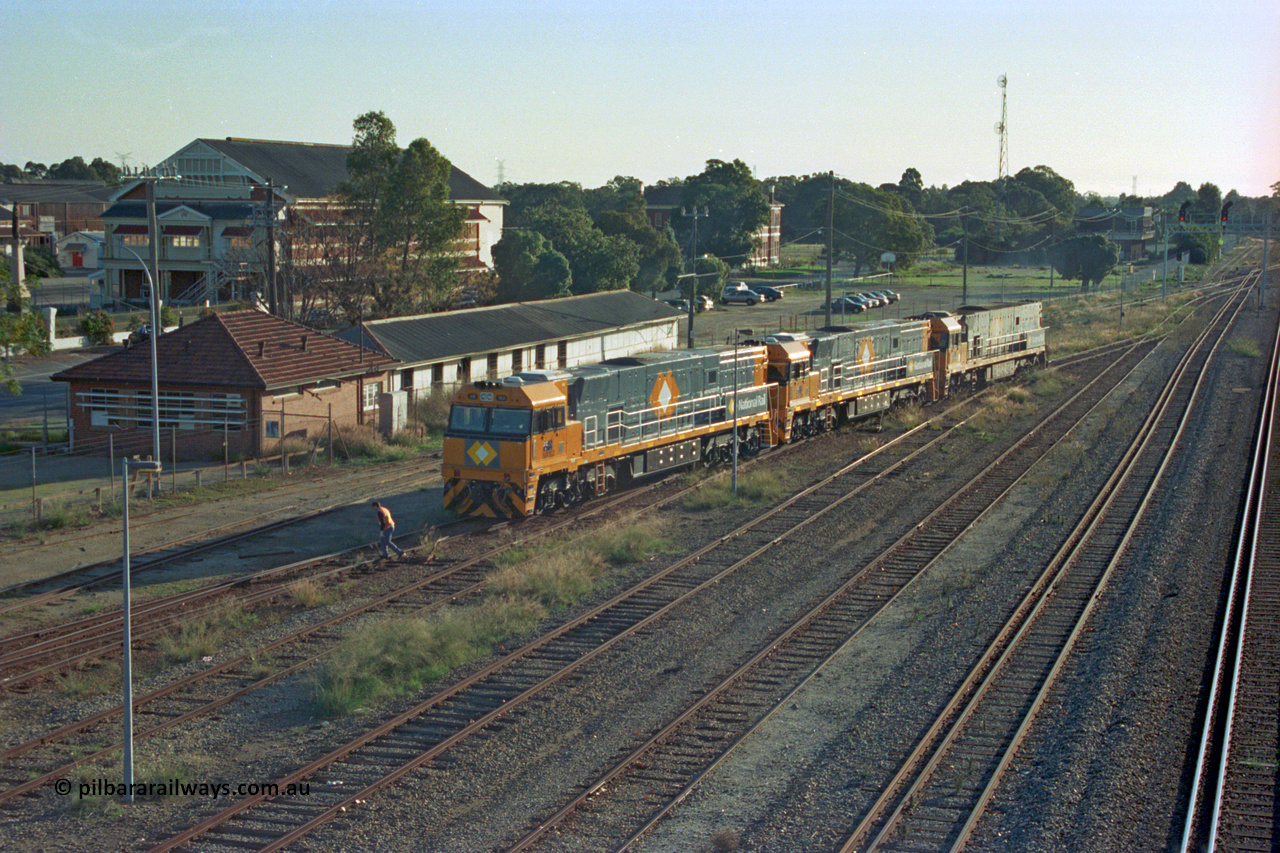 201-17
Midland, two brand Goninan WA built GE Cv40-9i model NR class units NR 102 serial 7250-07/97-302 and NR 101 serial 7250-07/97-303 lead the original Perth built NR 61 serial 7250-11/96-263 as the shunt around the yard.
Keywords: NR-class;NR102;Goninan;GE;CV40-9i;7250-07/97-302;