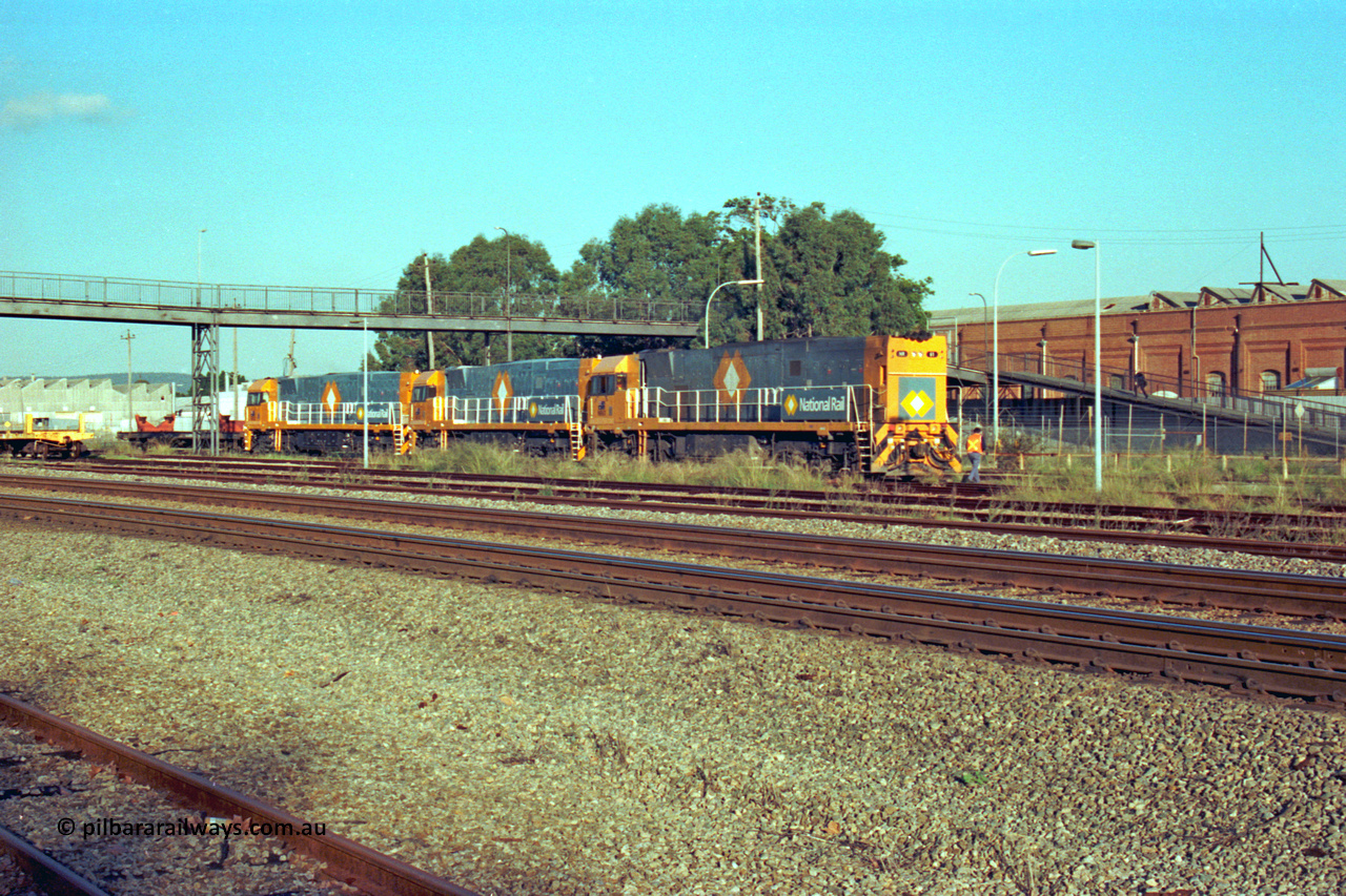 201-26
Midland, the first Perth built NR class NR 61 Goninan GE model Cv40-9i serial 7250-11/96-263 shunts at Midland with two brand new NR units NR 101 and NR 102 with waggon RQRX 60177.
Keywords: NR-class;NR61;Goninan;GE;CV40-9i;7250-11/96-263;