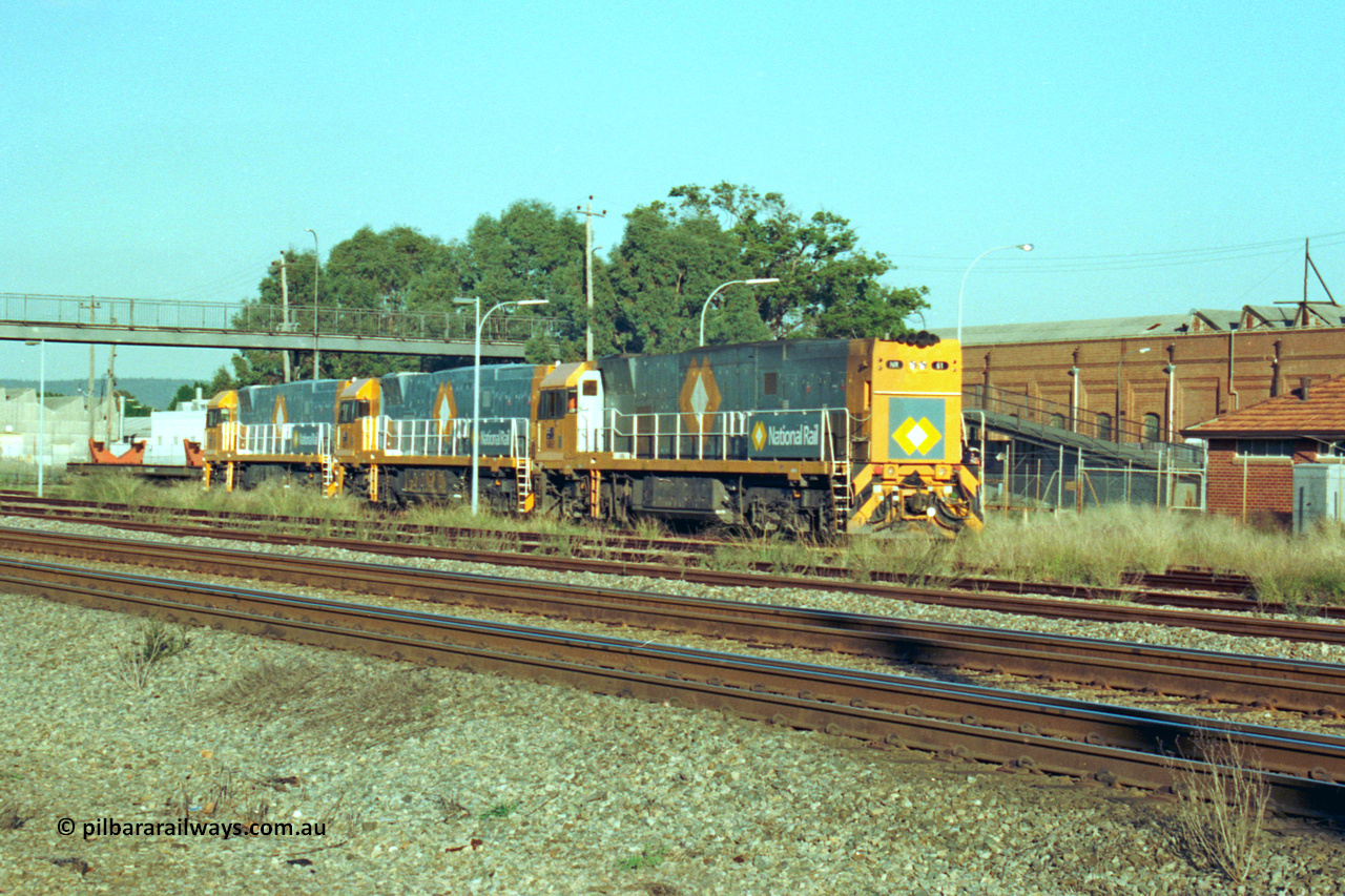 201-27
Midland, the first Perth built NR class NR 61 Goninan GE model Cv40-9i serial 7250-11/96-263 shunts at Midland with two brand new NR units NR 101 and NR 102 with waggon RQRX 60177.
Keywords: NR-class;NR61;Goninan;GE;CV40-9i;7250-11/96-263;