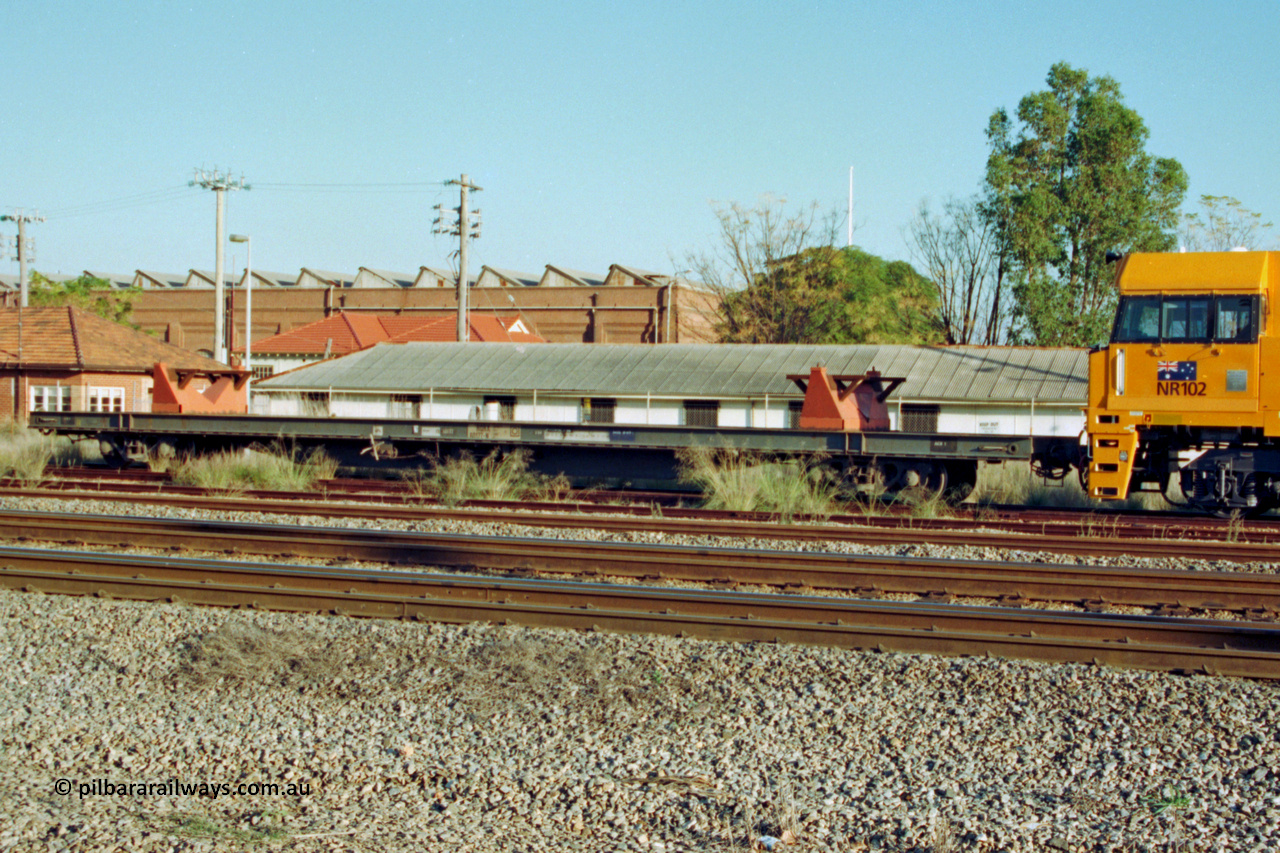 201-32
Midland, three quarter view of RQRX type waggon RQRX 60177 53 tonne capacity flat waggon coupled to new NR class NR 102, RQRX was converted from NQBX type NQBX 21782.
Keywords: RQRX-type;RQRX60177;Comeng-NSW;CBX-type;CBX21782;