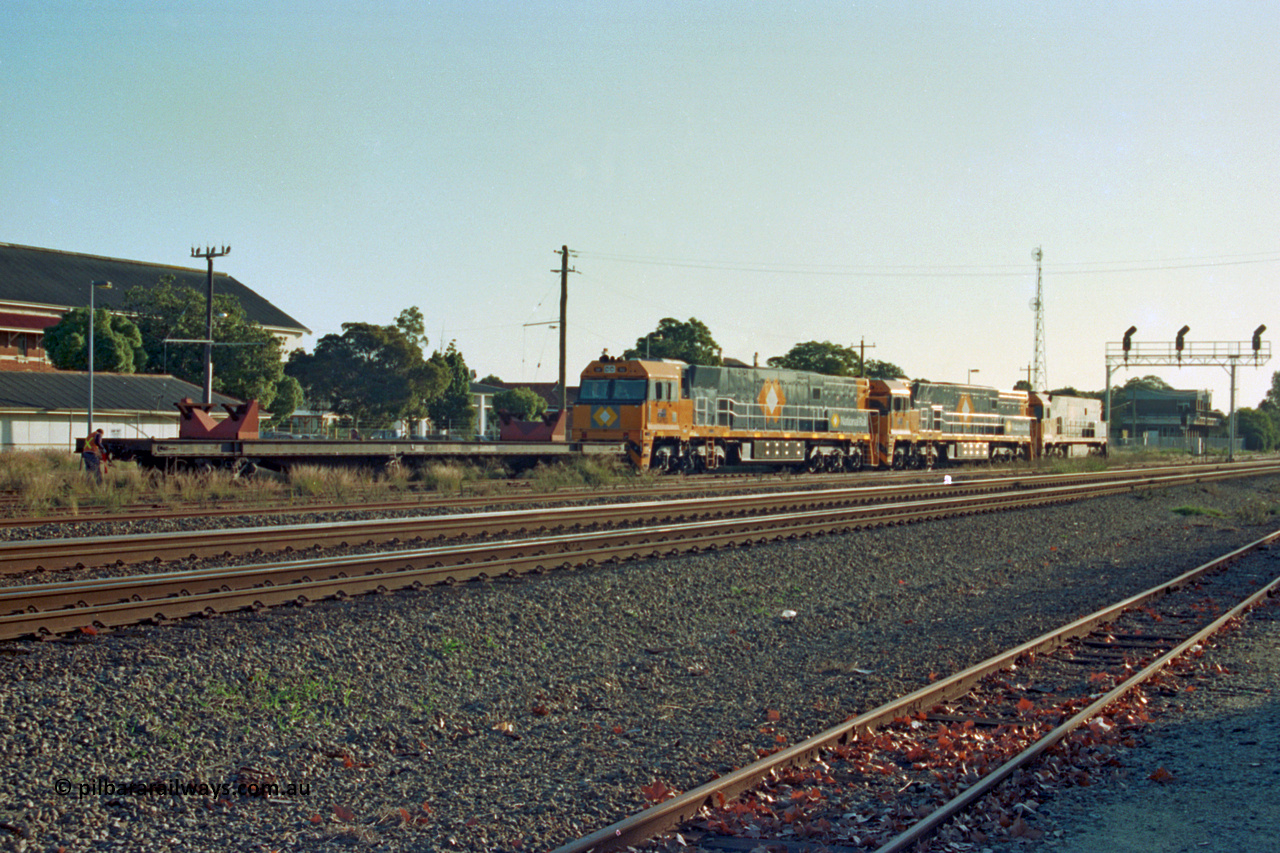 201-34
Midland, two brand Goninan WA built GE Cv40-9i model NR class units NR 102 serial 7250-07/97-302 and NR 101 serial 7250-07/97-303 with the original Perth built NR 61 serial 7250-11/96-263 as they await departure with RQRX type waggon RQRX 60177.
Keywords: RQRX-type;RQRX60177;Comeng-NSW;CBX-type;CBX21782;