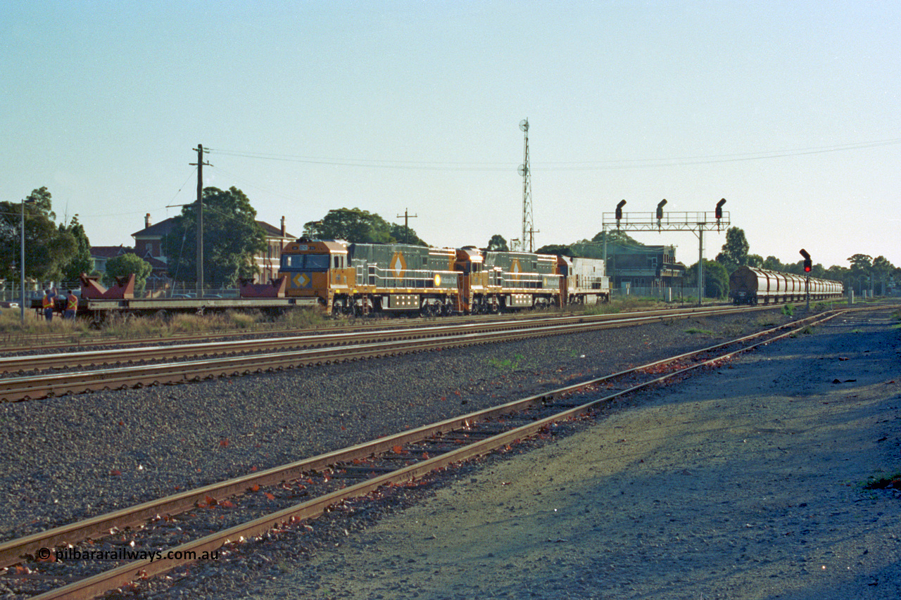 201-37
Midland, two brand Goninan WA built GE Cv40-9i model NR class units NR 102 serial 7250-07/97-302 and NR 101 serial 7250-07/97-303 with the original Perth built NR 61 serial 7250-11/96-263 as they await departure with RQRX type waggon RQRX 60177.
Keywords: NR-class;NR102;Goninan;GE;CV40-9i;7250-07/97-302;