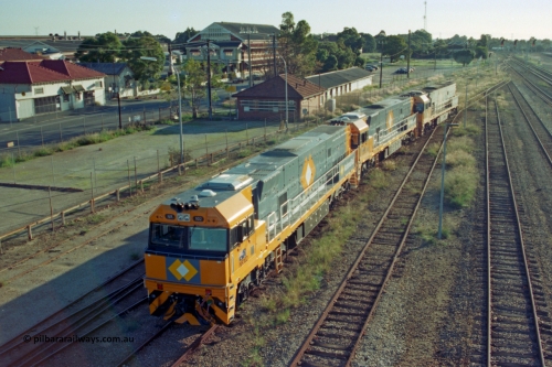 201-16
Midland, two brand Goninan WA built GE Cv40-9i model NR class units NR 102 serial 7250-07/97-302 and NR 101 serial 7250-07/97-303 lead the original Perth built NR 61 serial 7250-11/96-263 as the shunt around the yard.
Keywords: NR-class;NR102;Goninan;GE;CV40-9i;7250-07/97-302;