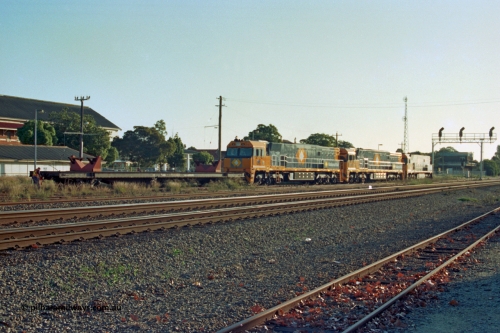201-34
Midland, two brand Goninan WA built GE Cv40-9i model NR class units NR 102 serial 7250-07/97-302 and NR 101 serial 7250-07/97-303 with the original Perth built NR 61 serial 7250-11/96-263 as they await departure with RQRX type waggon RQRX 60177.
Keywords: RQRX-type;RQRX60177;Comeng-NSW;CBX-type;CBX21782;