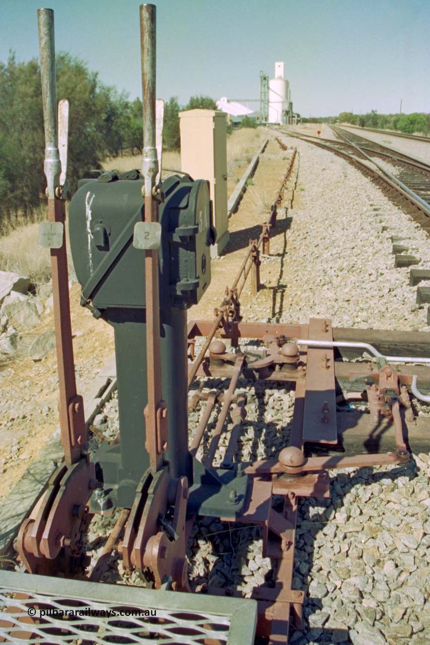 202-12
Meckering, looking east at the interlocking levers #1 and #2 and Pilot Key box 5A for the goods siding and derail at the west end of the crossing loop.
