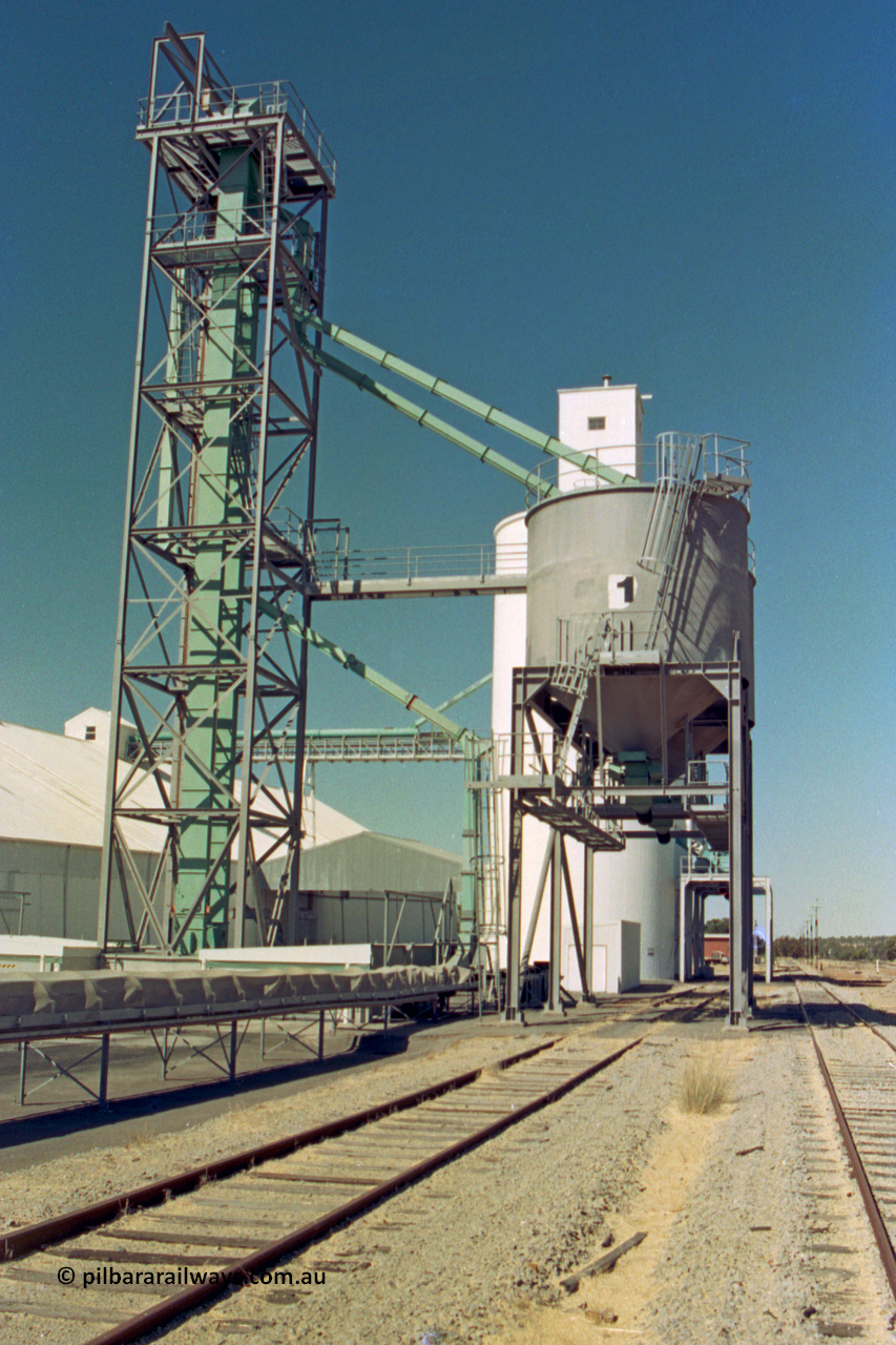 202-16
Meckering, looking east, grain elevator with loadout dual overhead bunker bins with #1 closet to camera, the goods loop is running to the right of the loadout bin.
