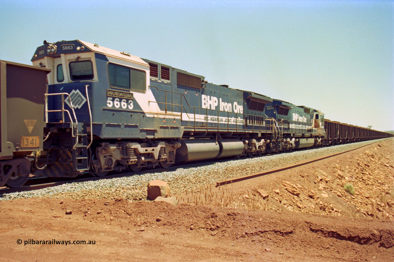 202-32
Yandi One, 307 km grade crossing, mid-train remote CM40-8ML Goninan GE unit 5663 'Newcastle' serial 8412-08/94-154 was originally built 'cabless' but now fitted with one, also note the difference in the ALCo builds by the fuel tanks, 5666 was originally an M636C built by Comeng while 5663 was originally built by AE Goodwin.
Keywords: 5663;Goninan;GE;CM40-8ML;8412-08/94-154;rebuild;AE-Goodwin;ALCo;M636C;5476;G6047-8;