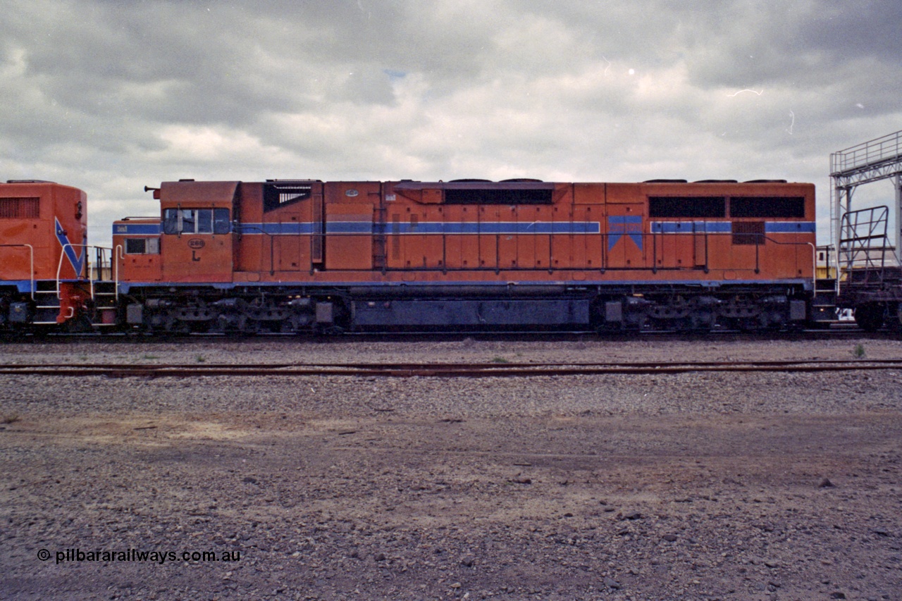 208-2-15
Midland, Westrail L class L 260 Clyde Engineering EMD model GT26C serial 68-550, second unit on the midday east bound freighter, side view, 27th September 1991.
Keywords: L-class;L260;Clyde-Engineering-Granville-NSW;EMD;GT26C;68-550;