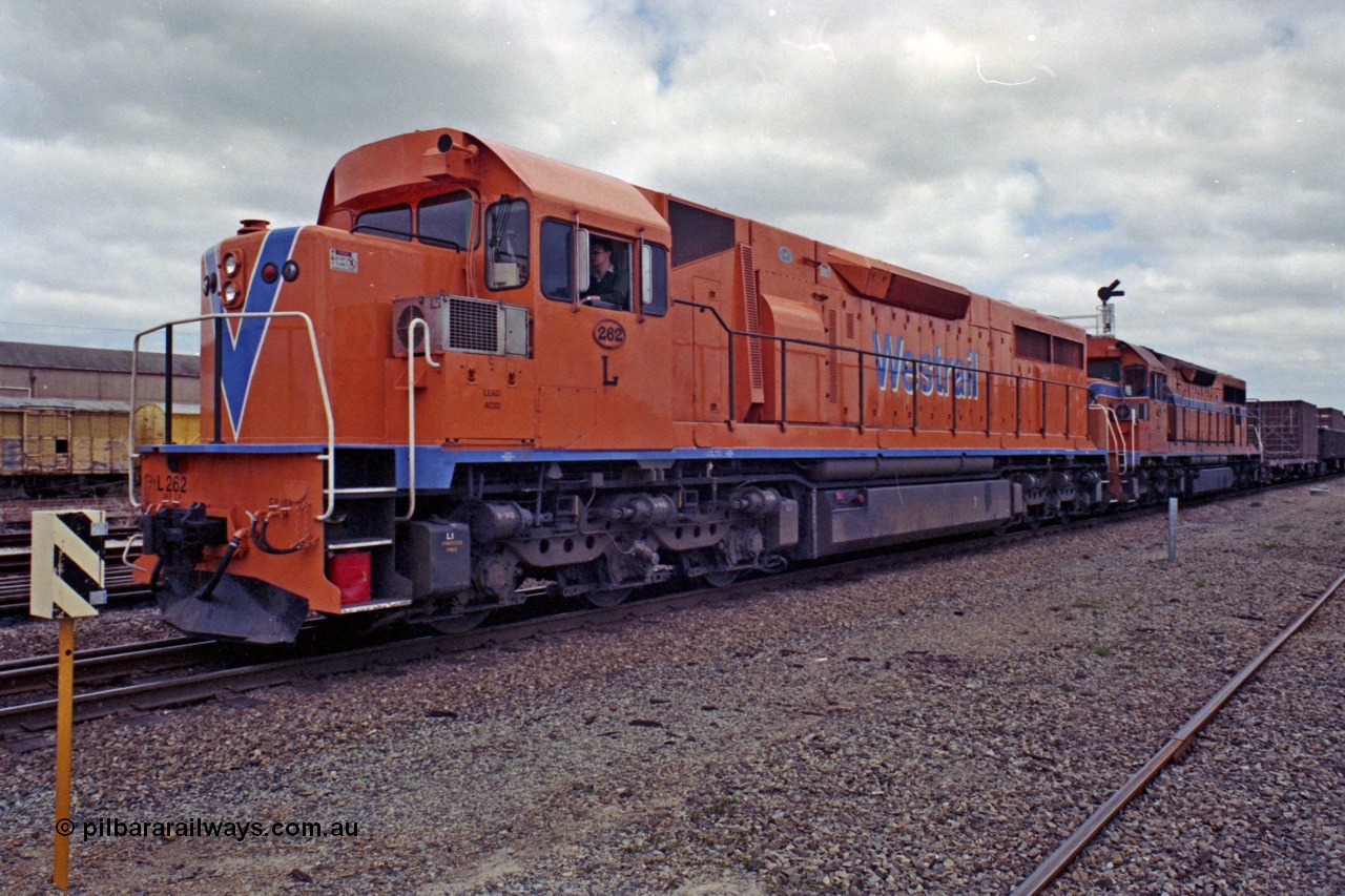 208-2-17
Midland, Westrail L class L 262 Clyde Engineering EMD model GT26C serial 68-552, leading another L class unit on the midday east bound freighter as they prepare to depart, 27th September 1991.
Keywords: L-class;L262;Clyde-Engineering-Granville-NSW;EMD;GT26C;68-552;