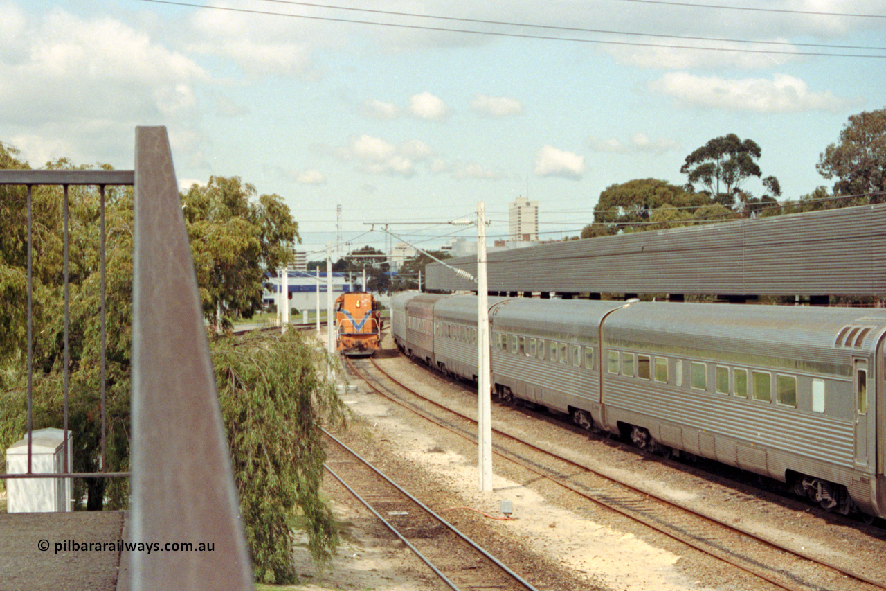 209-01
East Perth Passenger Terminal, Westrail L class L 272 Clyde Engineering EMD model GT26C serial 69-621 shunts flat waggons around the Indian Pacific consist.
